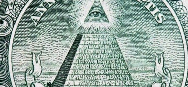 A dollar bill with a pyramid and all seeing eye on it.