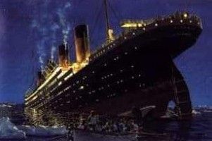 A large cruise ship is sinking in the ocean at night.