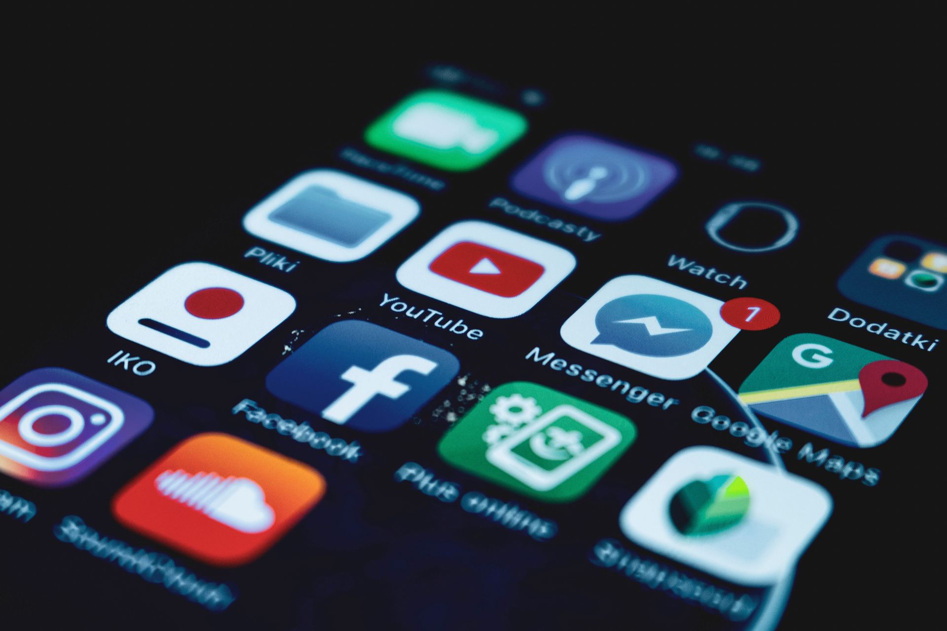Detailed close-up view of a smartphone screen displaying various popular social media app icons.