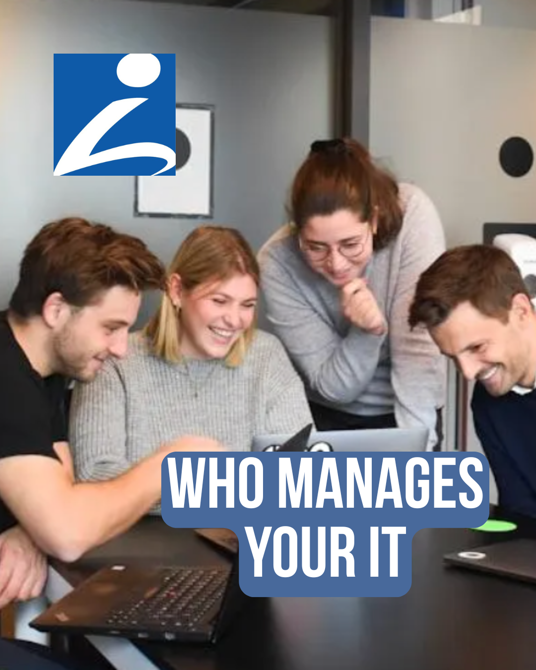 Four people collaborating around a laptop in an office. They are looking at the screen, smiling.