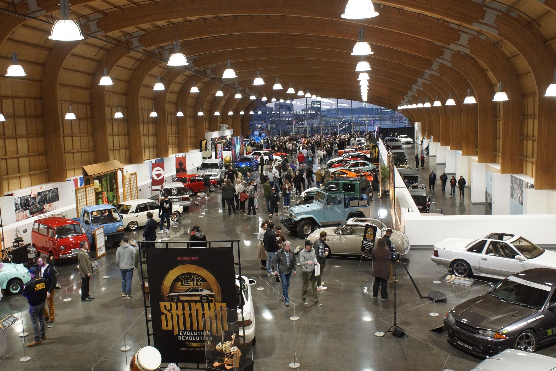 An aerial view of a car show with a sign that says shrimp