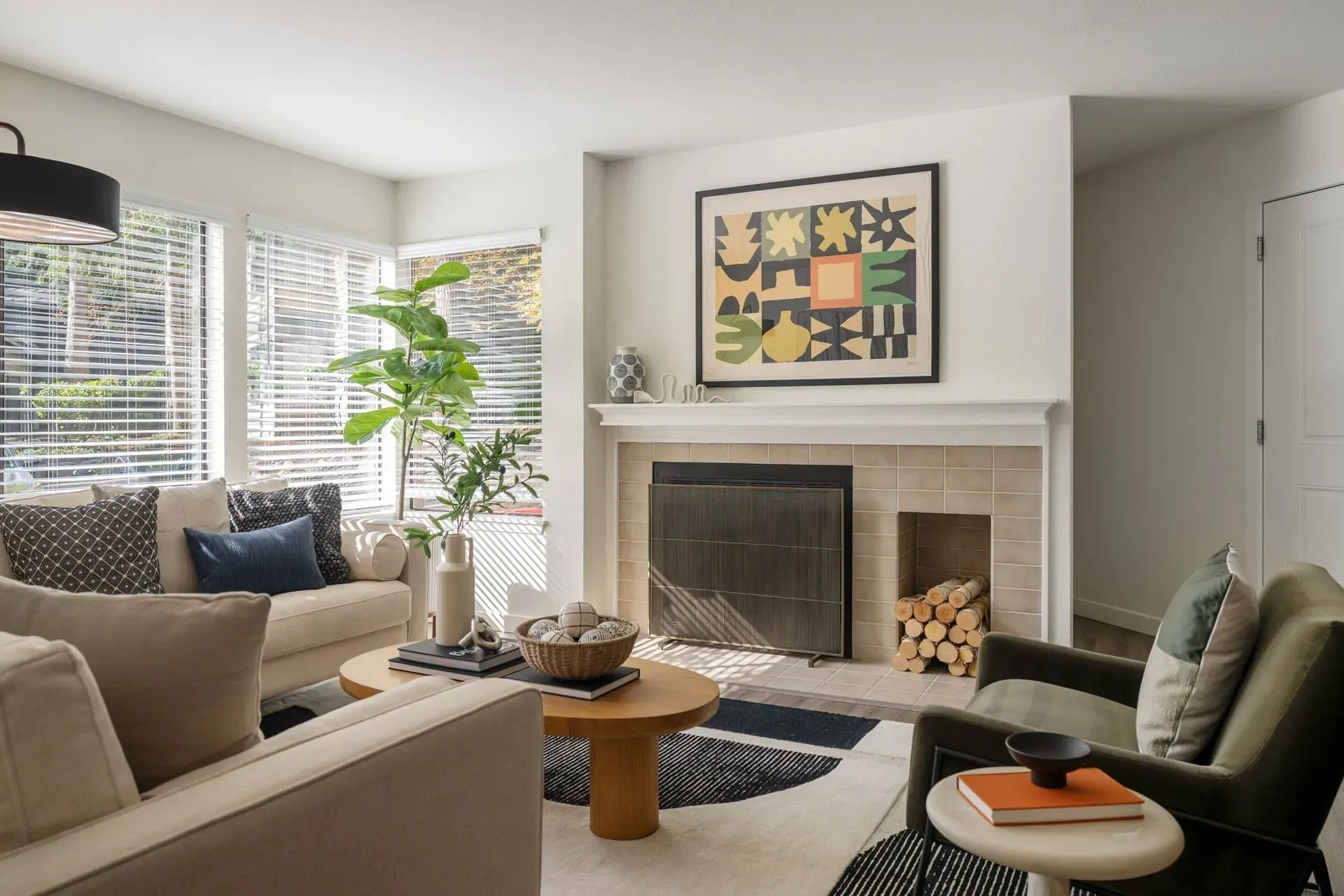 A living room filled with furniture and a fireplace.