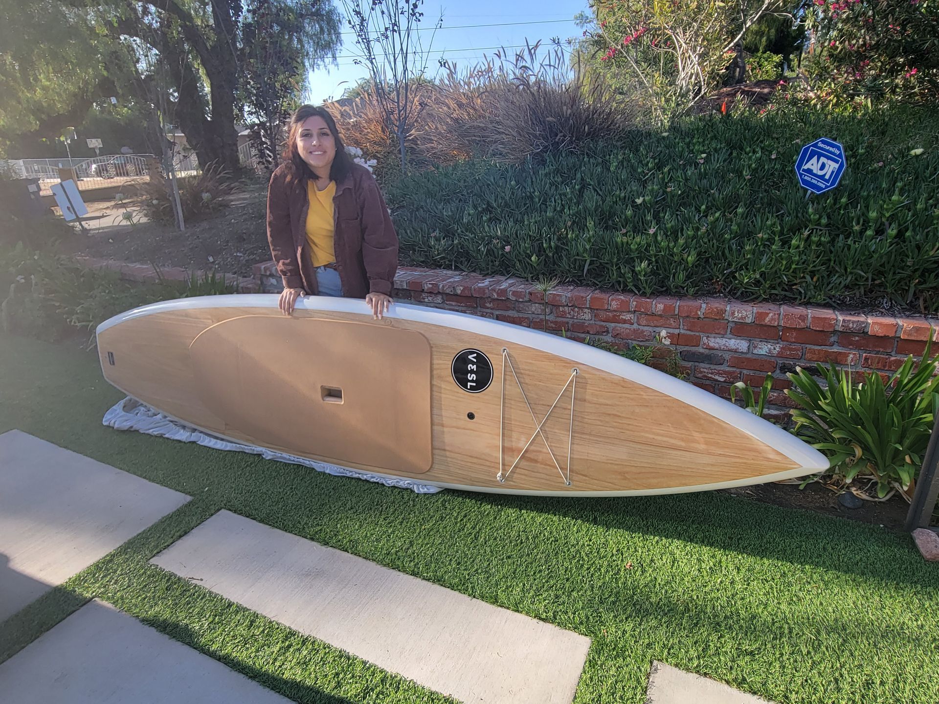paddle board on synthetic turf