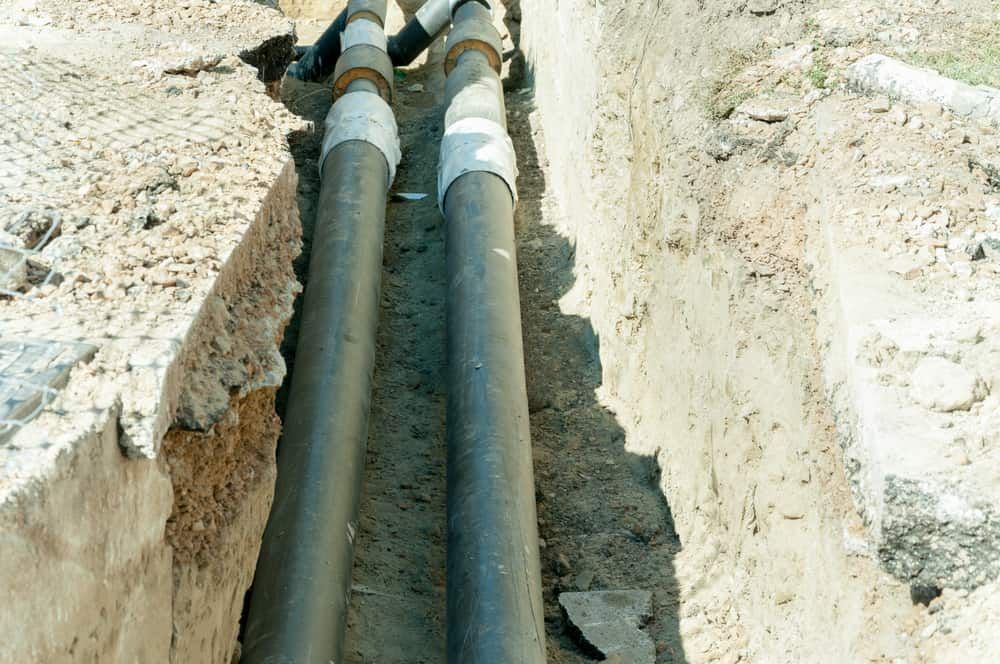 Two Pipes Are Connected to Each Other in a Trench — Tony Gordon Septic Tank Cleaning in Newee Creek, NSW