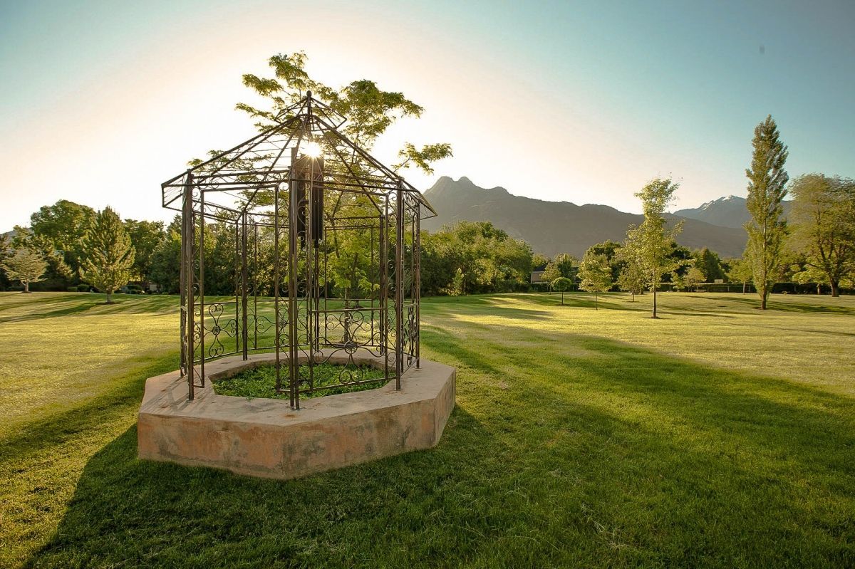 Memorial Mortuaries & Cemeteries Cemetery grounds with mountains at sunrise