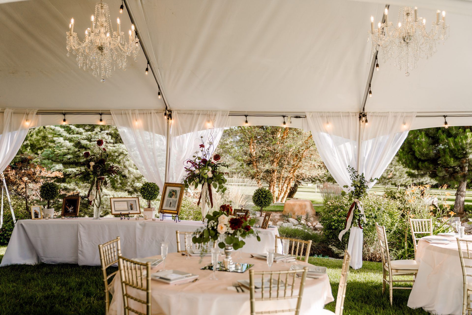 Memorial Mortuaries Celebration of life tent set up with tables, chairs and flowers