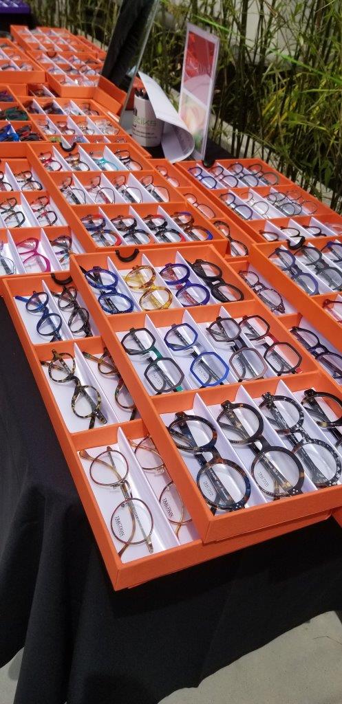 Orange display boxes of colorful frames at Raise Your Glasses 2019 Event