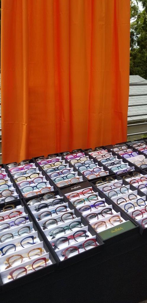 2 rows of many colorful eyeglass frames at Raise Your Glasses 2019 Event