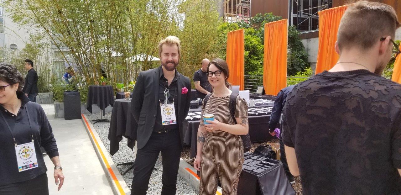 Vendor and guest smiling and posing at Raise Your Glasses 2019 Event