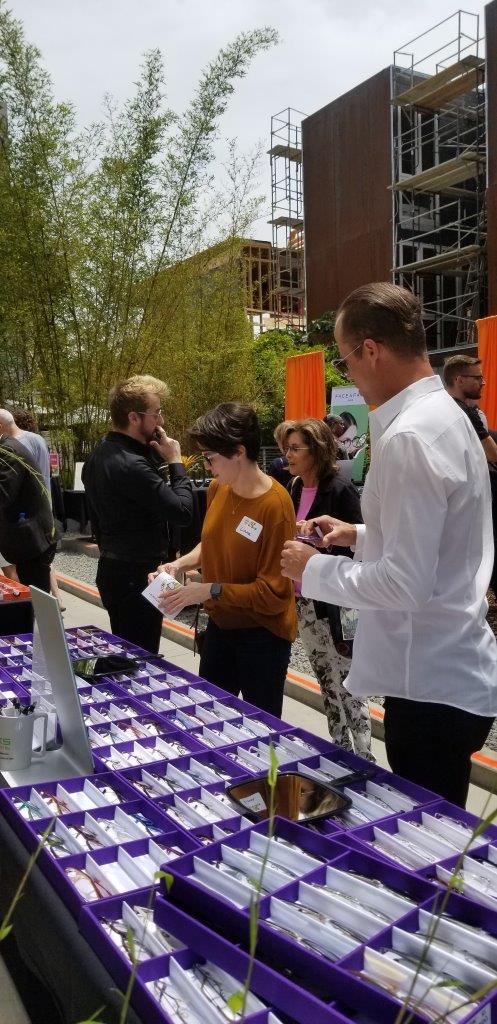 People standing outside viewing frames at Raise Your Glasses 2019 Event