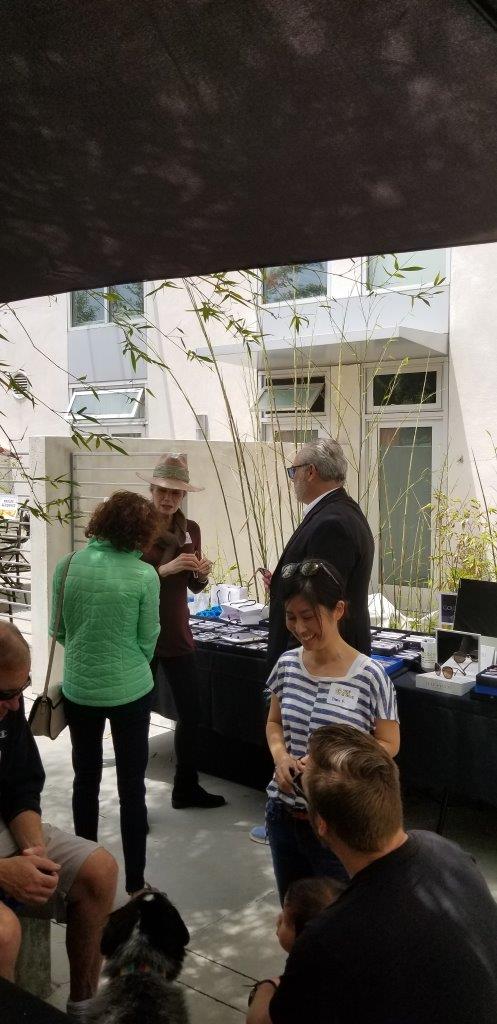 People chatting and standing outside at Raise Your Glasses 2019 Event