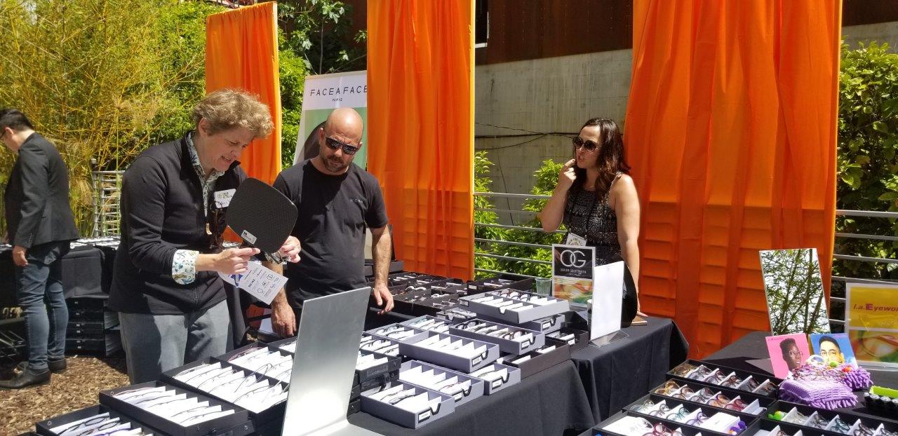 People looking frameline options at Raise Your Glasses 2019 Event