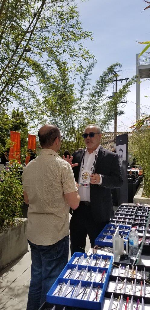 Vendor and shopper chatting at Raise Your Glasses 2019 Event