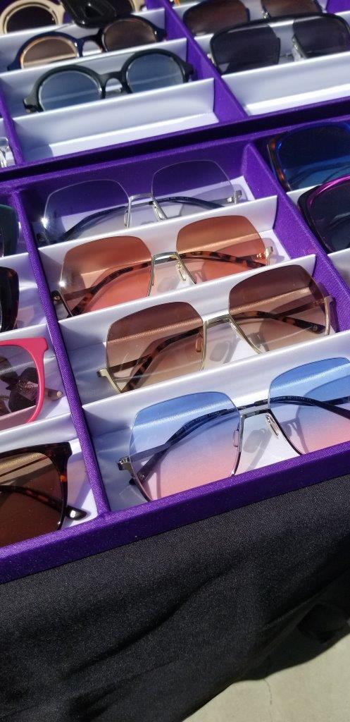 Display of colorful sunglasses at Raise Your Glasses 2019 Event