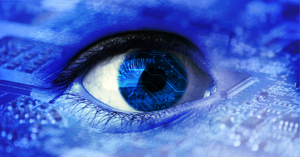 A close up of a blue eye with a blue background.