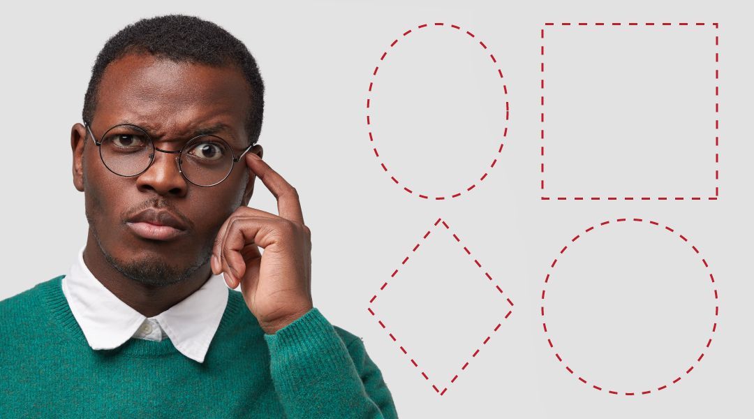 A man wearing glasses with a confused look on his face and pointing his finger to his temple.