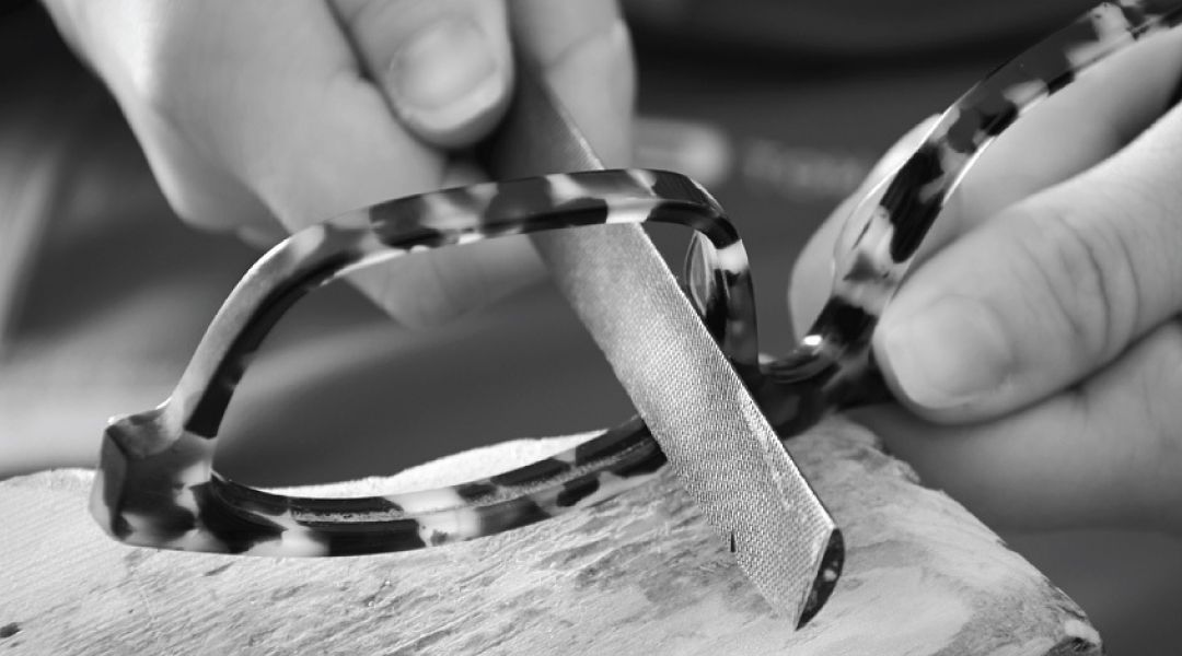 Person handcrafting a pair of acetate frames