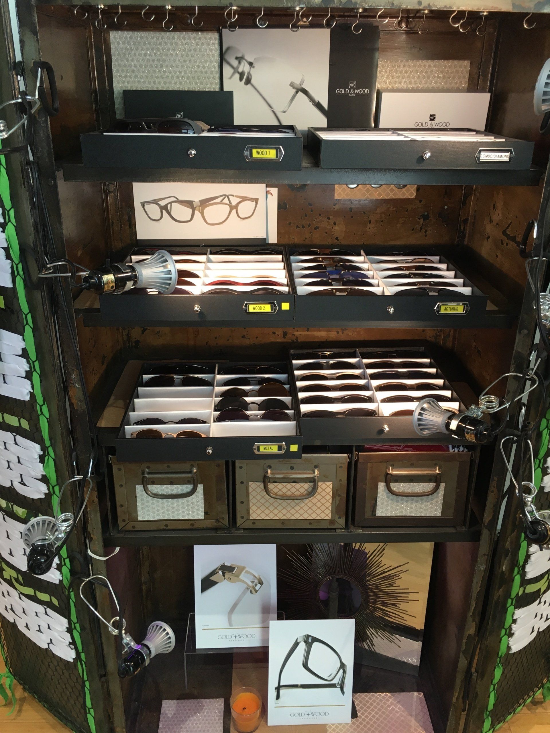 Display cases with frames at 2016 trunk show event
