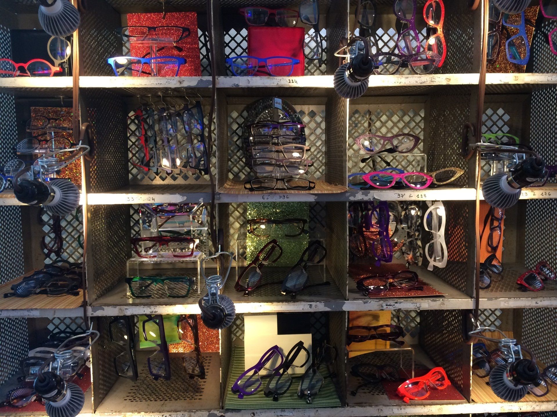 Display of colorful frames at Theo Trunk Show event at Urban Optiks