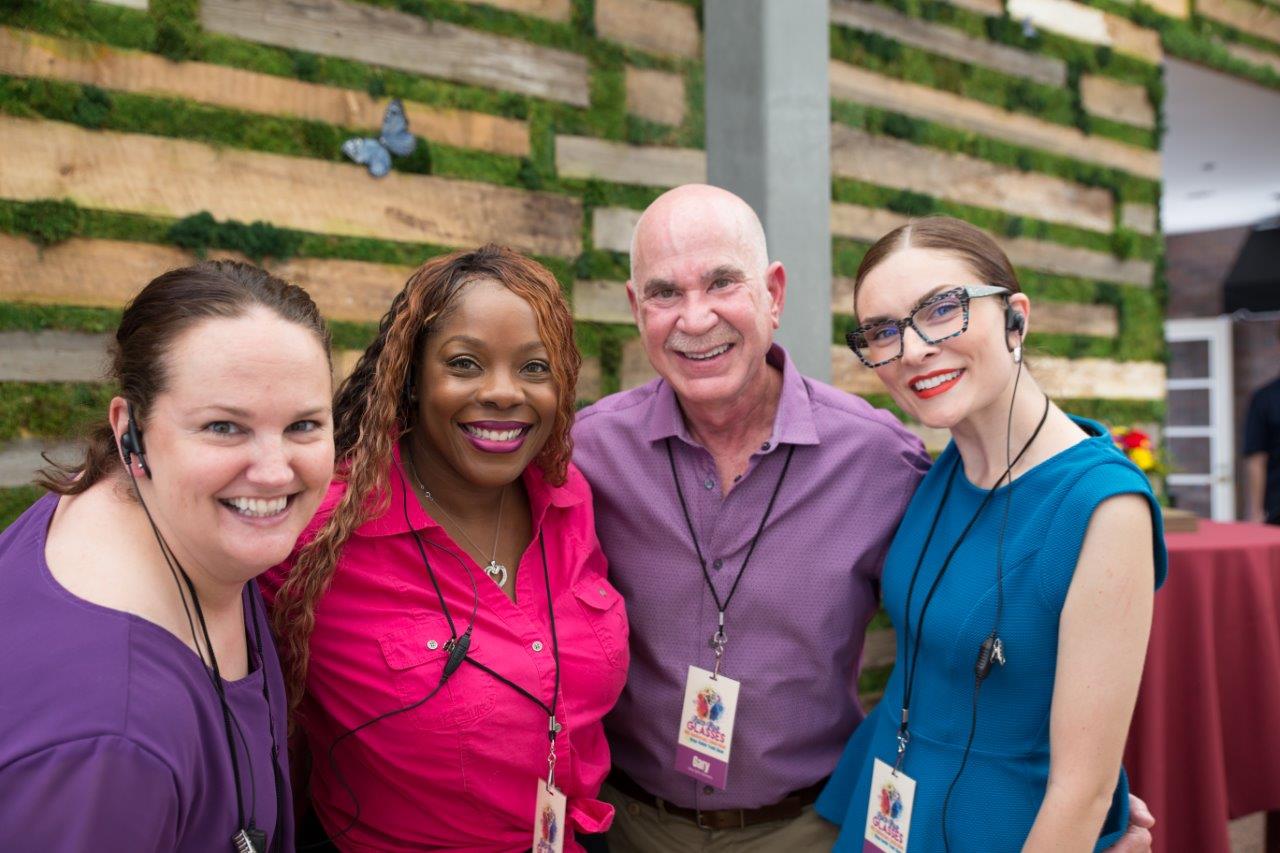 4 staff members posing at 2018 Raise Your Glasses