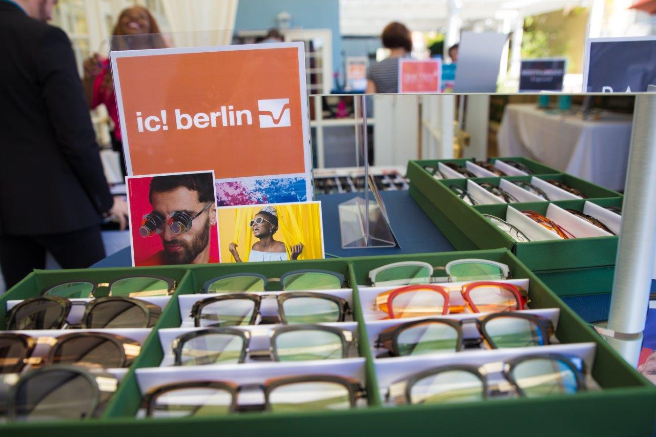 Display boxes and ic berlin sign at outdoor table at Raise Your Glasses 2018 Event