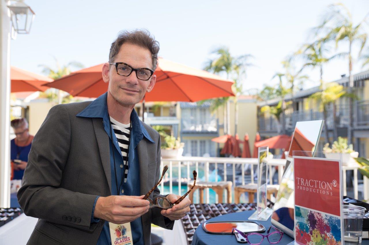 Vendor showing off frameline selections at Raise Your Glasses 2018 Event