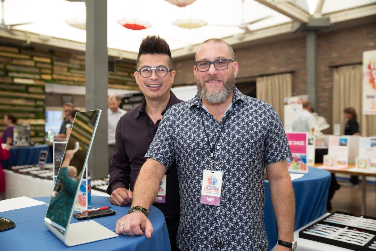 2 vendors wearing colorful eyeglasses  at Raise Your Glasses 2018 Event
