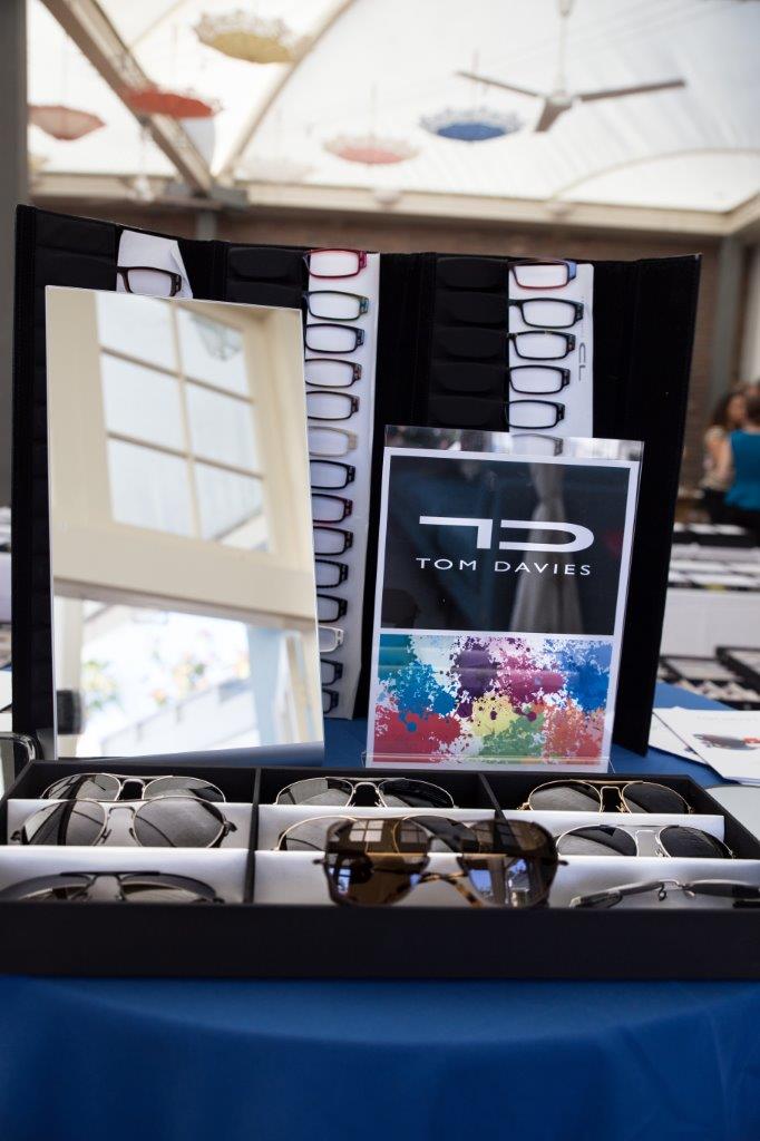 Tom Davies tabletop display with sign and frames at Raise Your Glasses 2018 Event