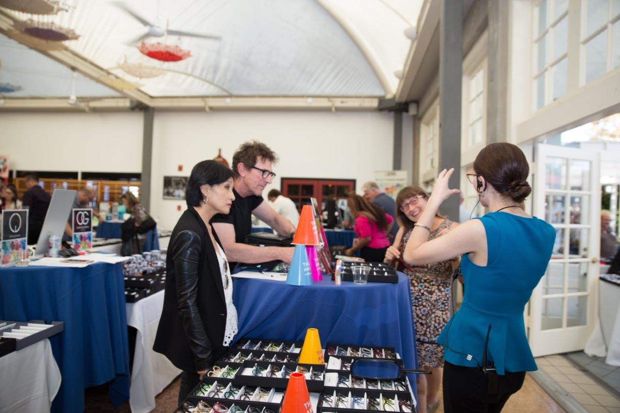 Vendors and shoppers chatting during Raise Your Glasses 2018 Event