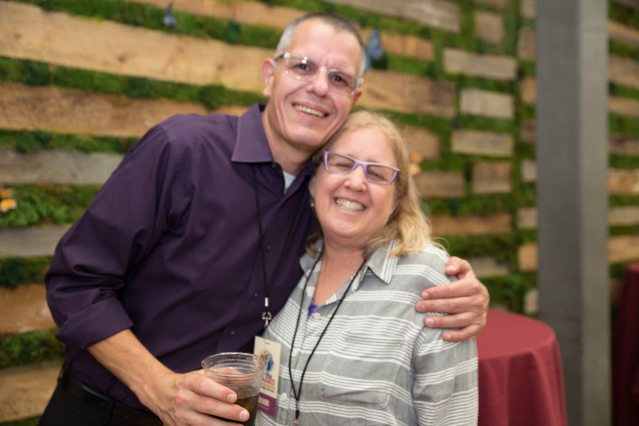 2 friends smiling and posing at Raise Your Glasses 2018 Event