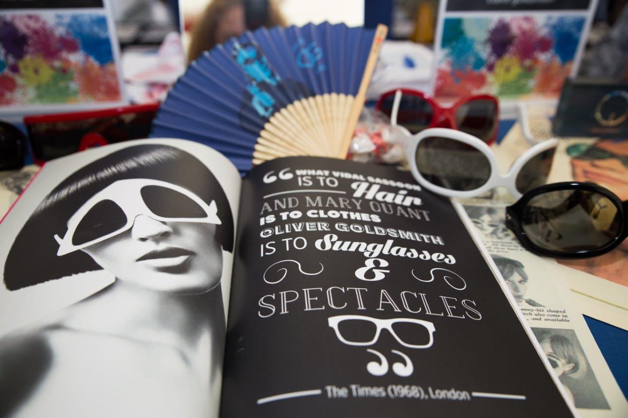 Oliver Goldsmith ad in magazine at Raise Your Glasses 2018 Event