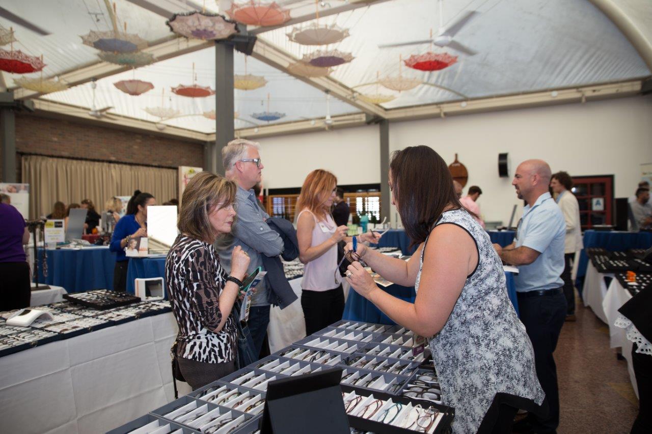 2 people sitting at reception table at Raise Your Glasses 2018 Event