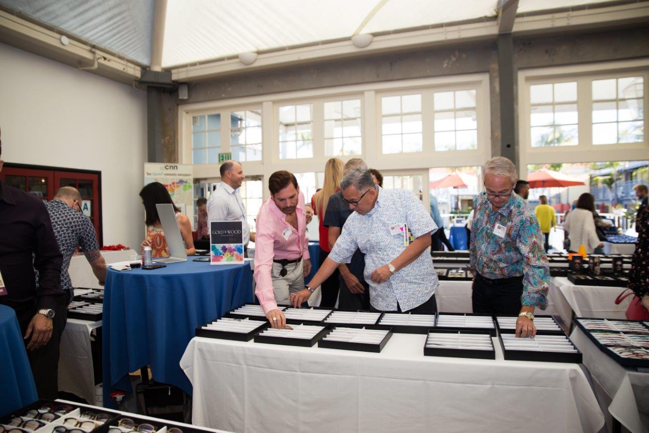 People admiring frame selections at Raise Your Glasses 2018 Event