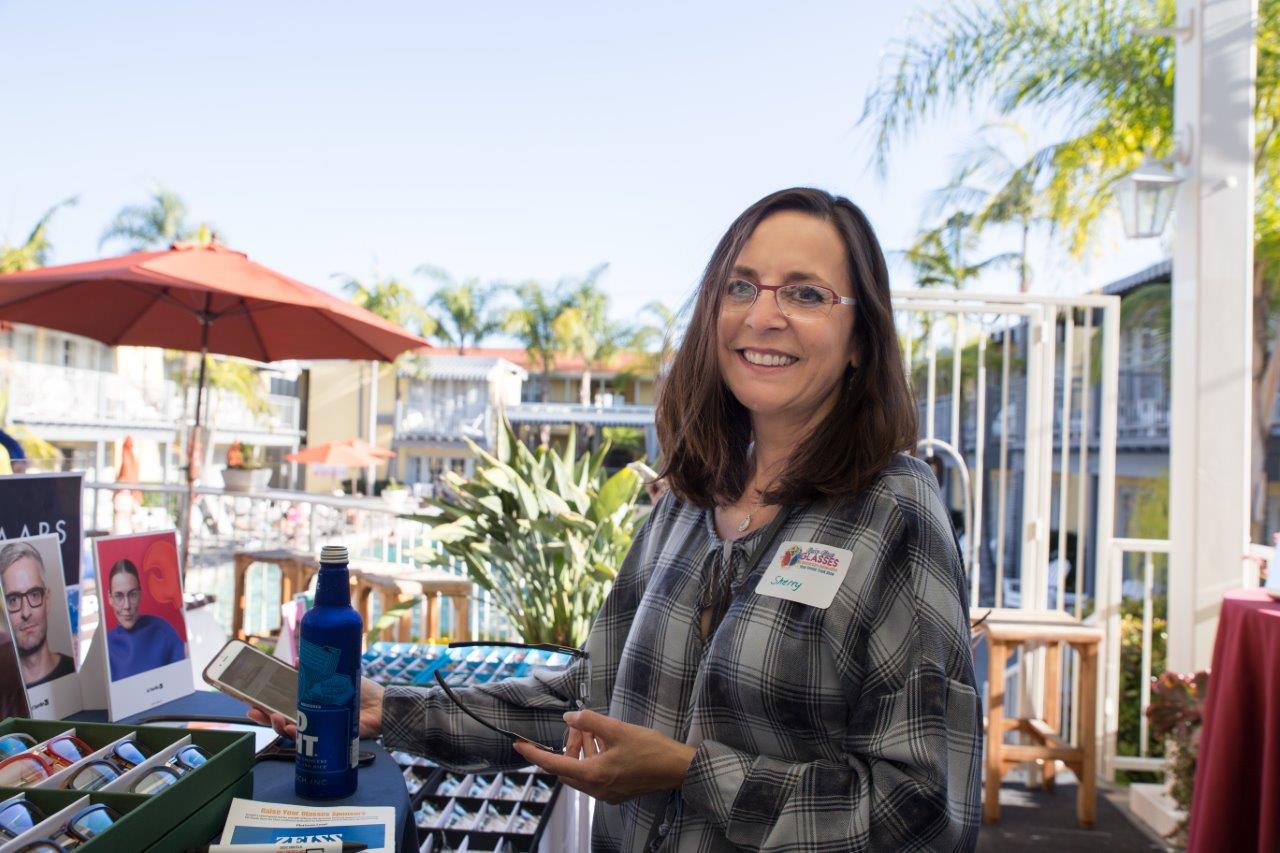 Person trying on frames at Raise Your Glasses 2018 Event