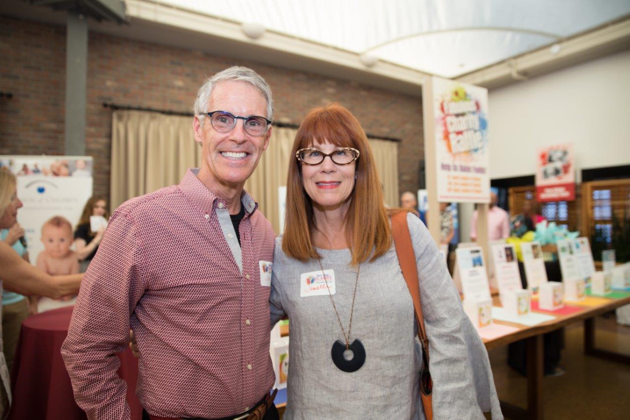 3 people wearing glasses and posing at Raise Your Glasses 2018 Event