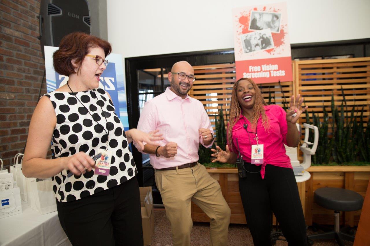 3 people laughing during Raise Your Glasses 2018 Event