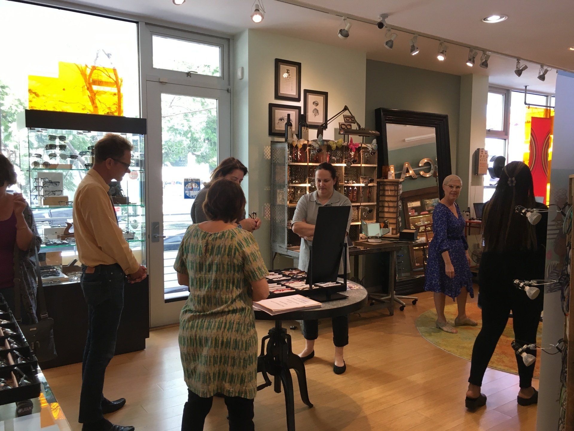 People viewing Francis Klein frames at 2017 Francis Klein Trunk Show