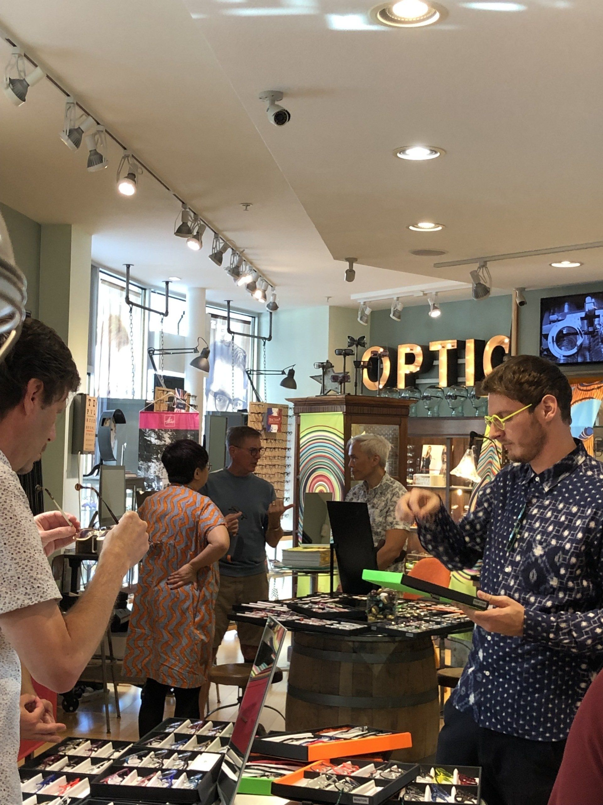 People shopping inside Urban Optiks during Theo Trunk Show Event