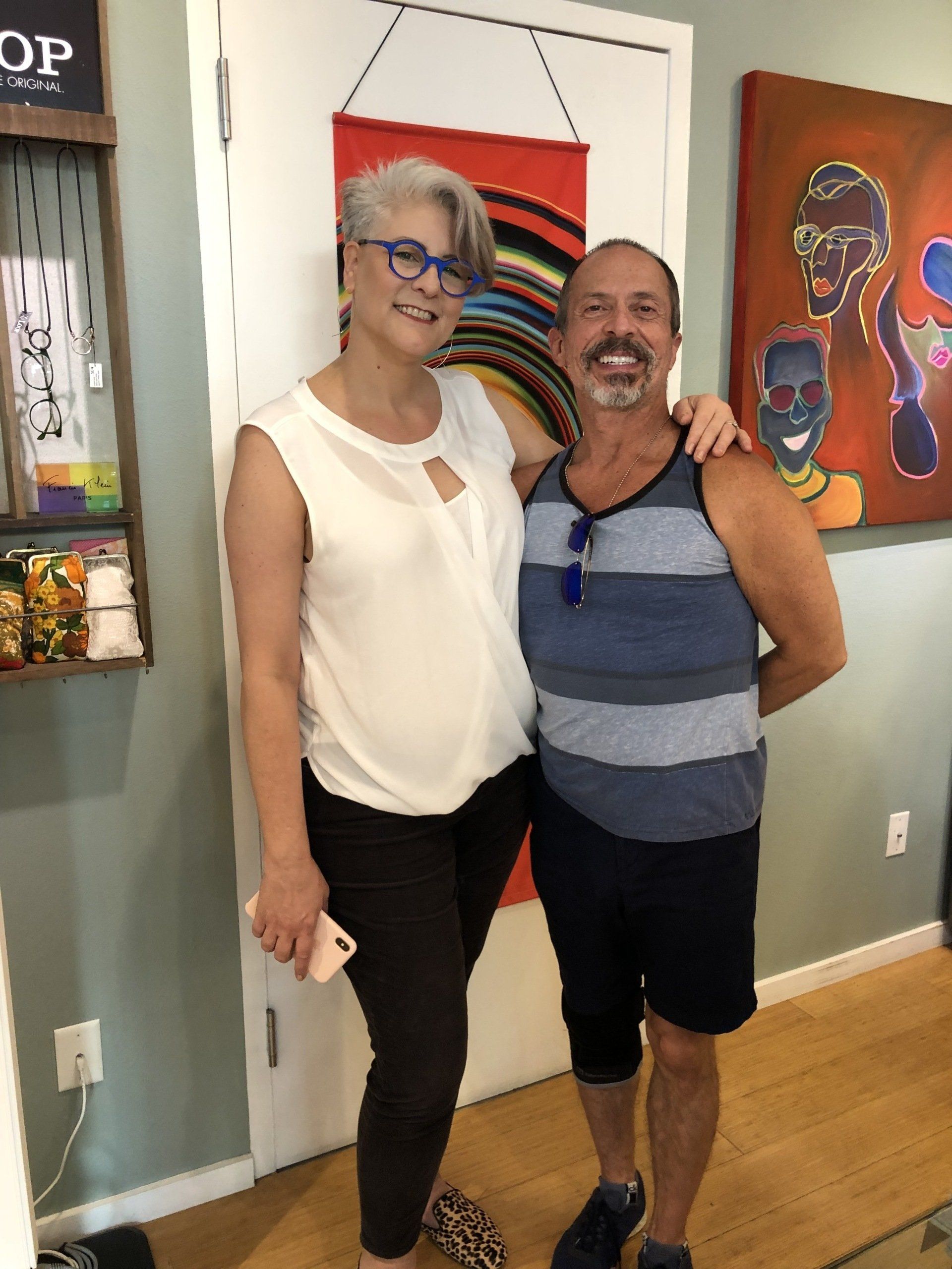 Two people posing inside store at Theo Trunk Show Event