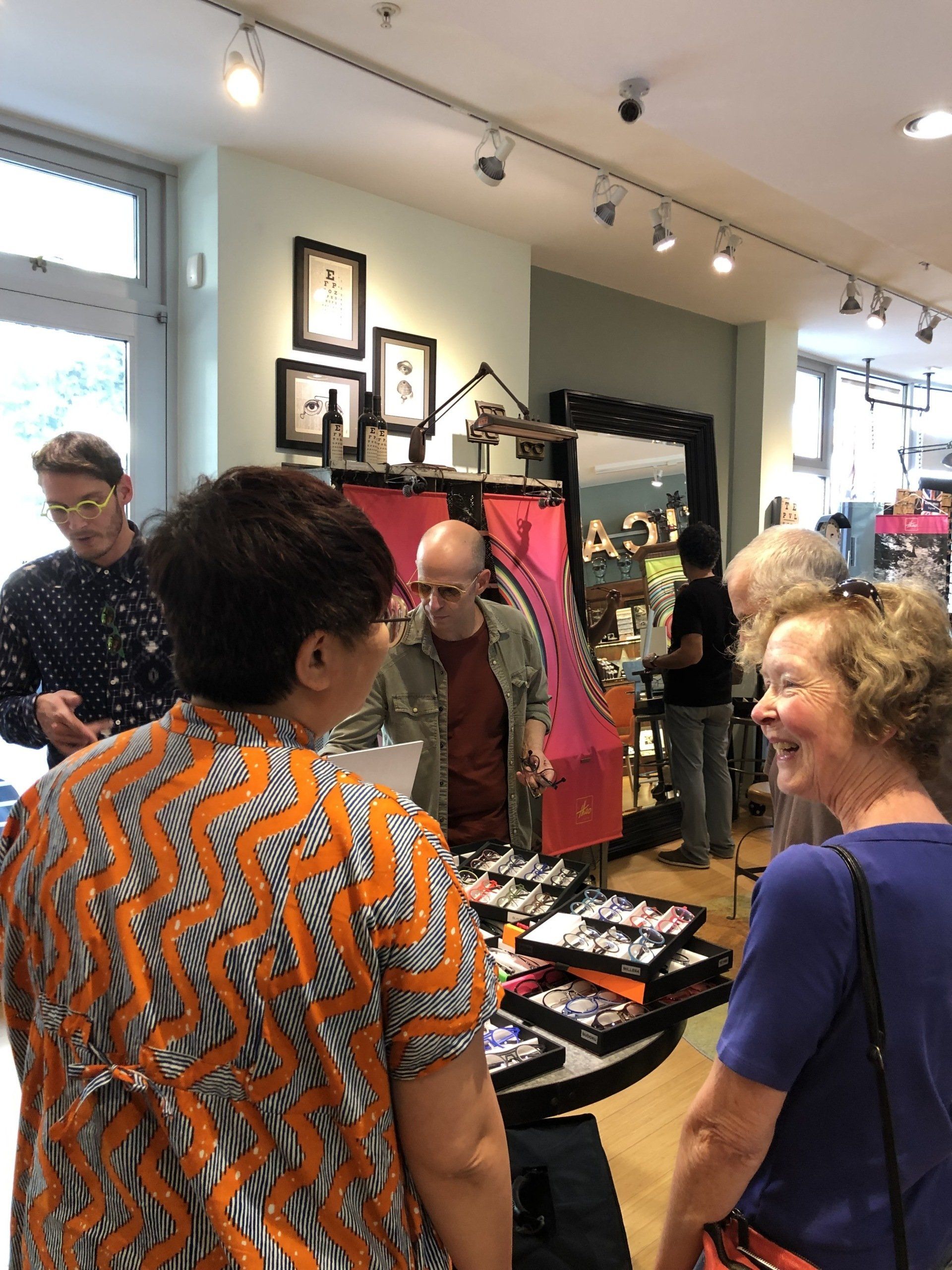 Two people standing inside store and chatting  at Theo Trunk Show Event
