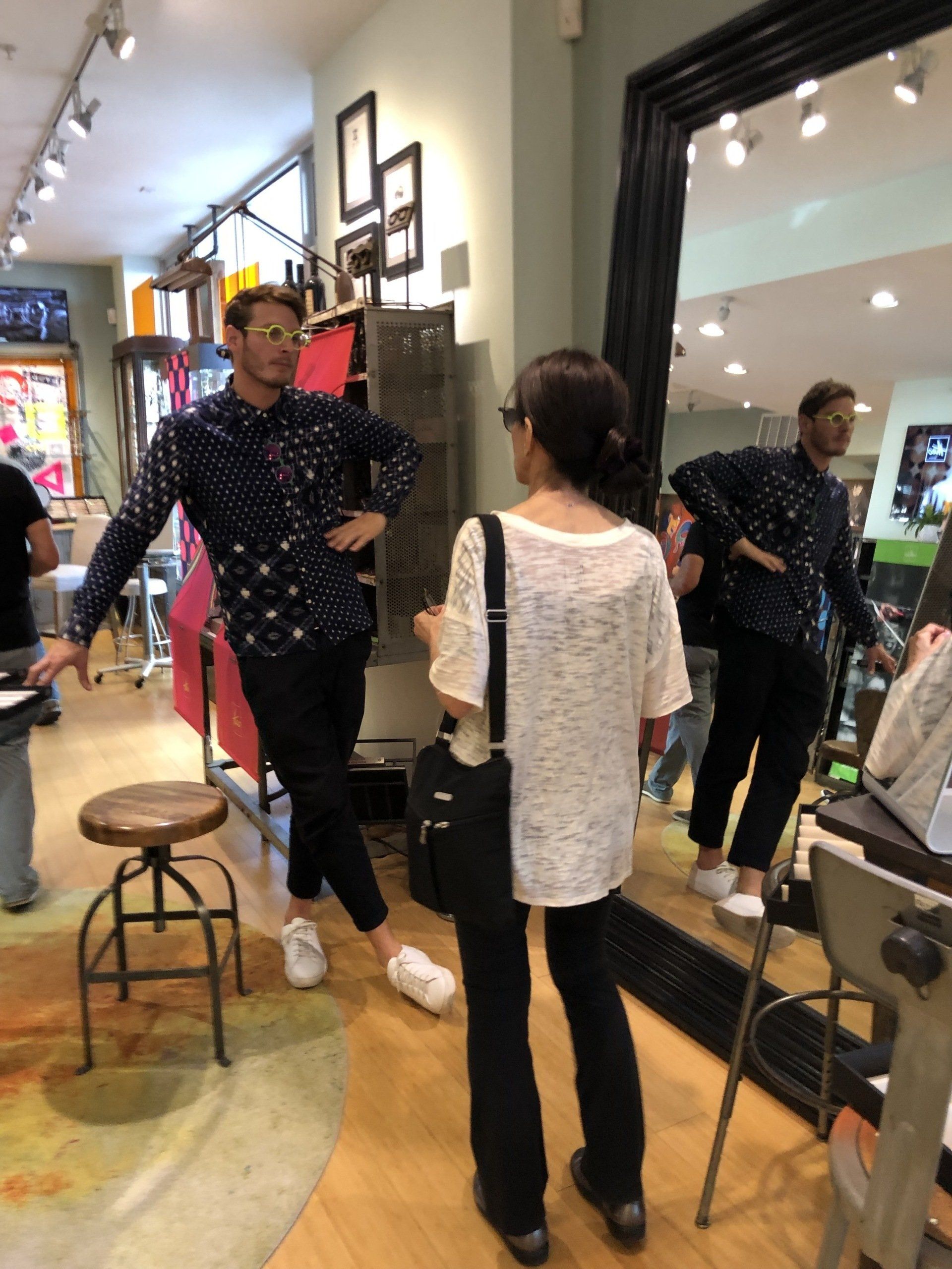 2 people standing in store talking at Theo Trunk Show Event