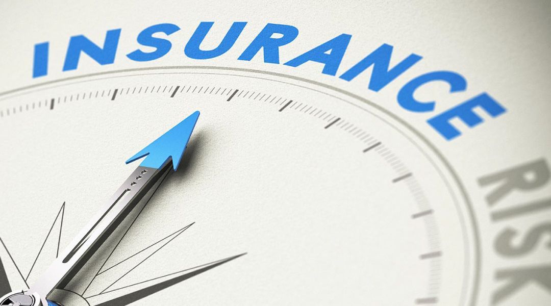 Circular dail with an arrow pointed at the word INSURANCE