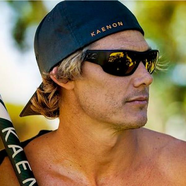 Man with a baseball cap wearing Kaenon Eyewear sunglasses