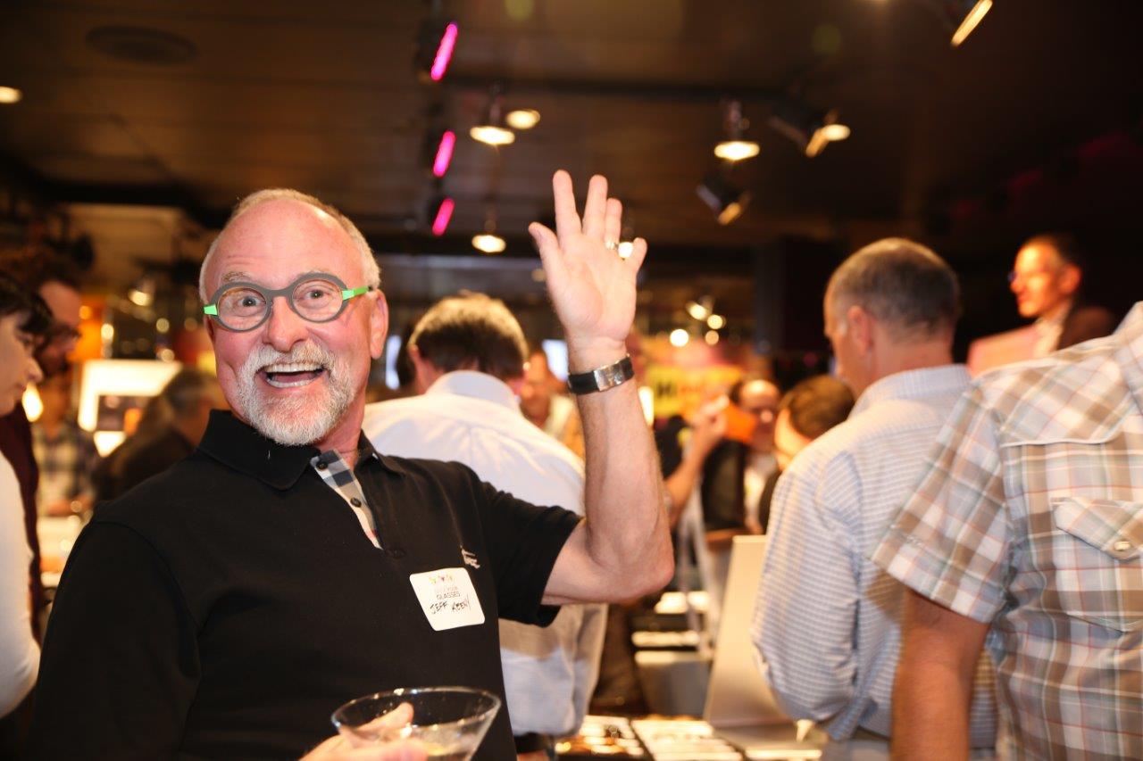 Happy people at Martinis Above Fourth at Raise Your Glasses event