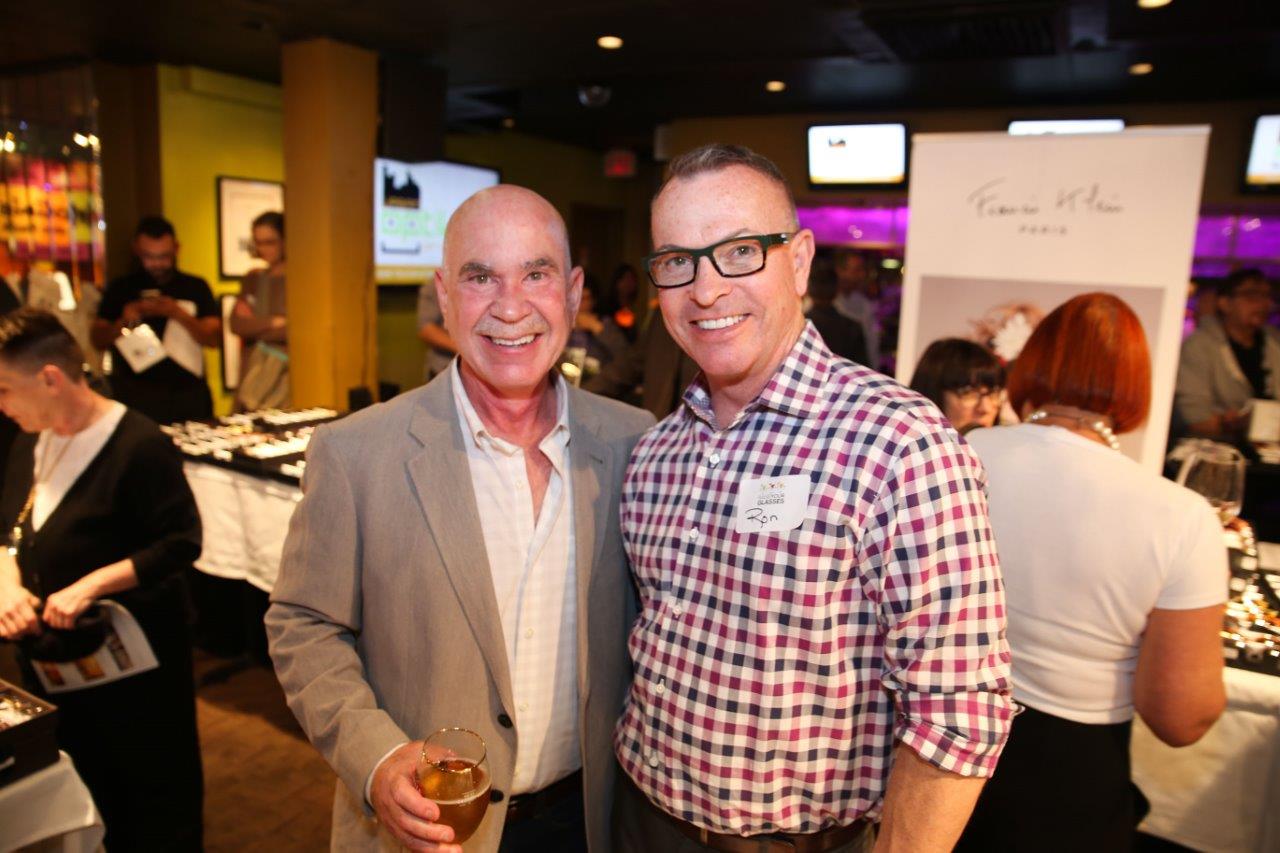 Two people enjoying Raise Your Glasses event