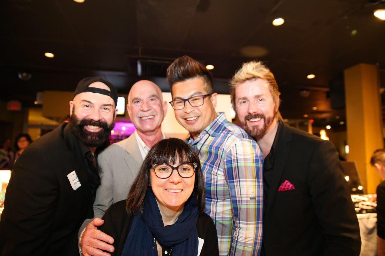 4 guests standing inside Martinis Above Fourth at Raise Your Glasses event
