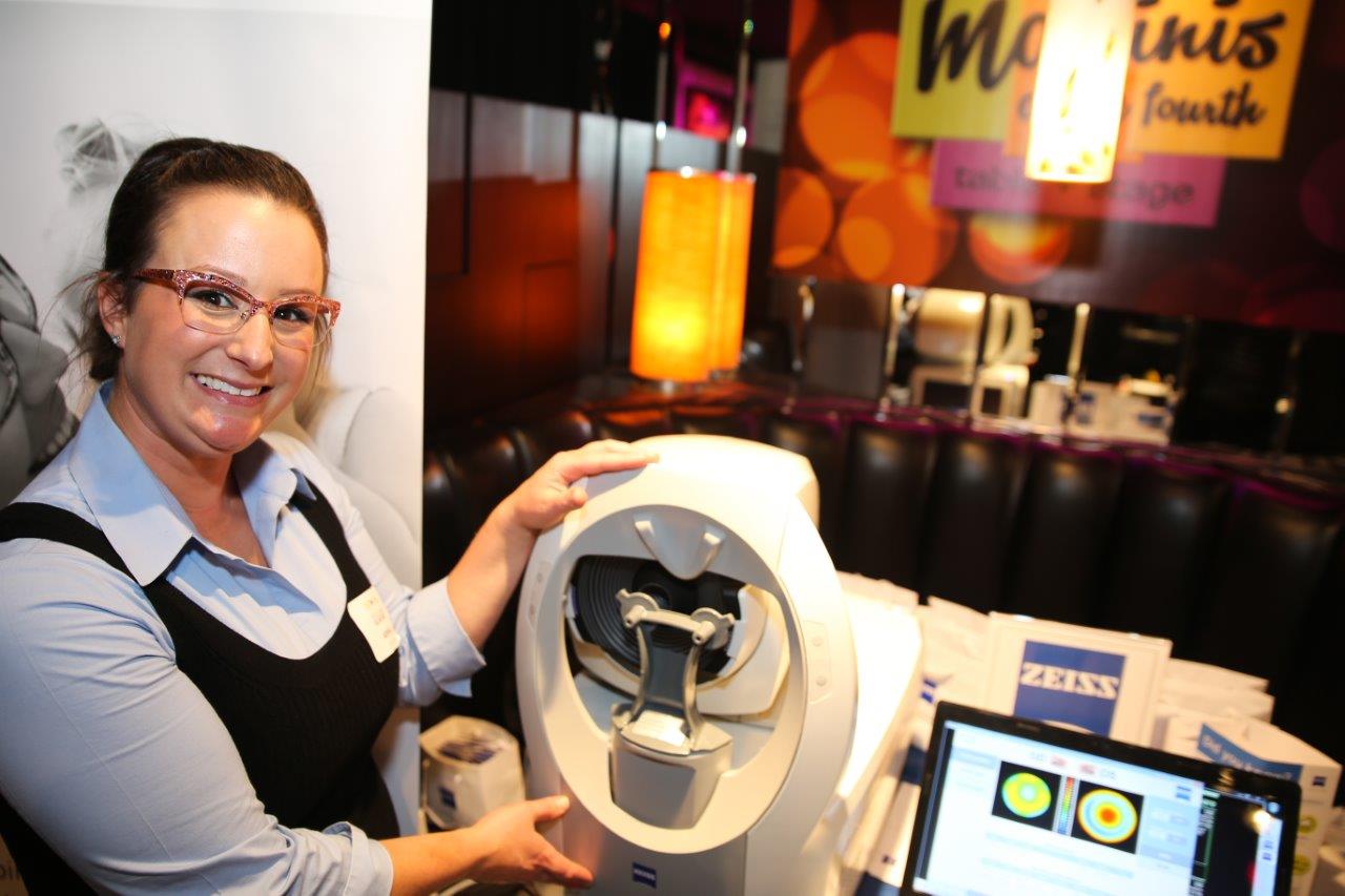 Vendor showing off a machine at Raise Your Glasses event