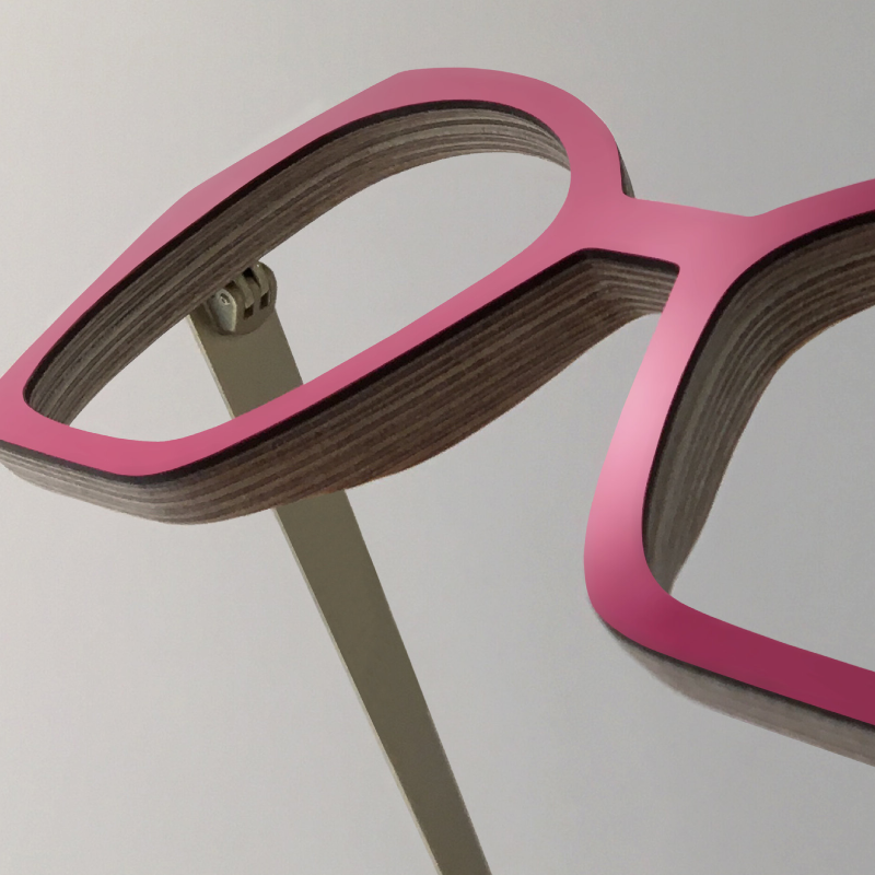 A pair of nina muir pink glasses showing the layers of wood
