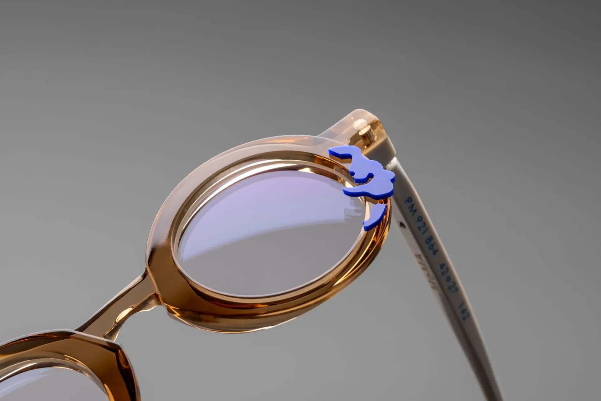 A pair of Pieroo Massara glasses in tortoise with purple splotches that look like water