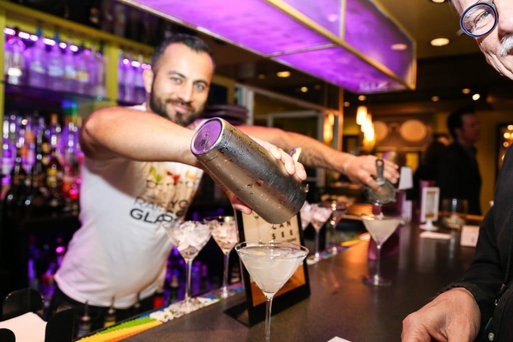Bartender pouring drinks at 2015 Raise Your Glasses event at Martinis Above Fourth